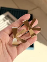 Gold Dangle Bow Earrings - Image 2